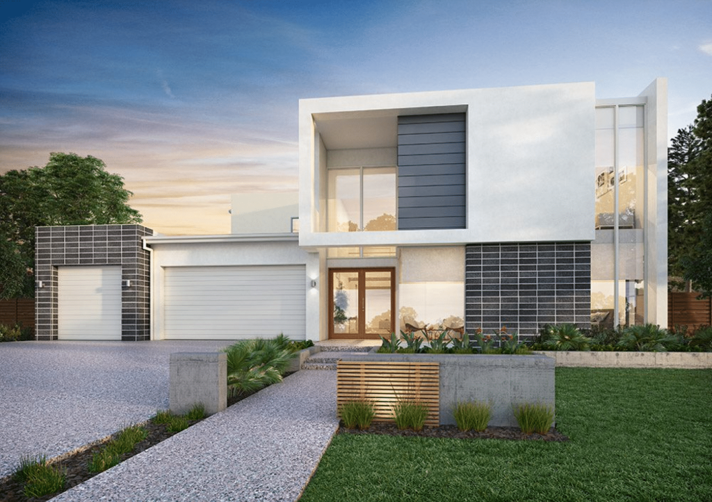 Modern two-story home with a stone driveway, large windows, and a garage at dusk.